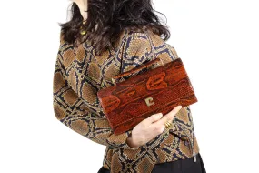 Orange-brown snake skin handbag