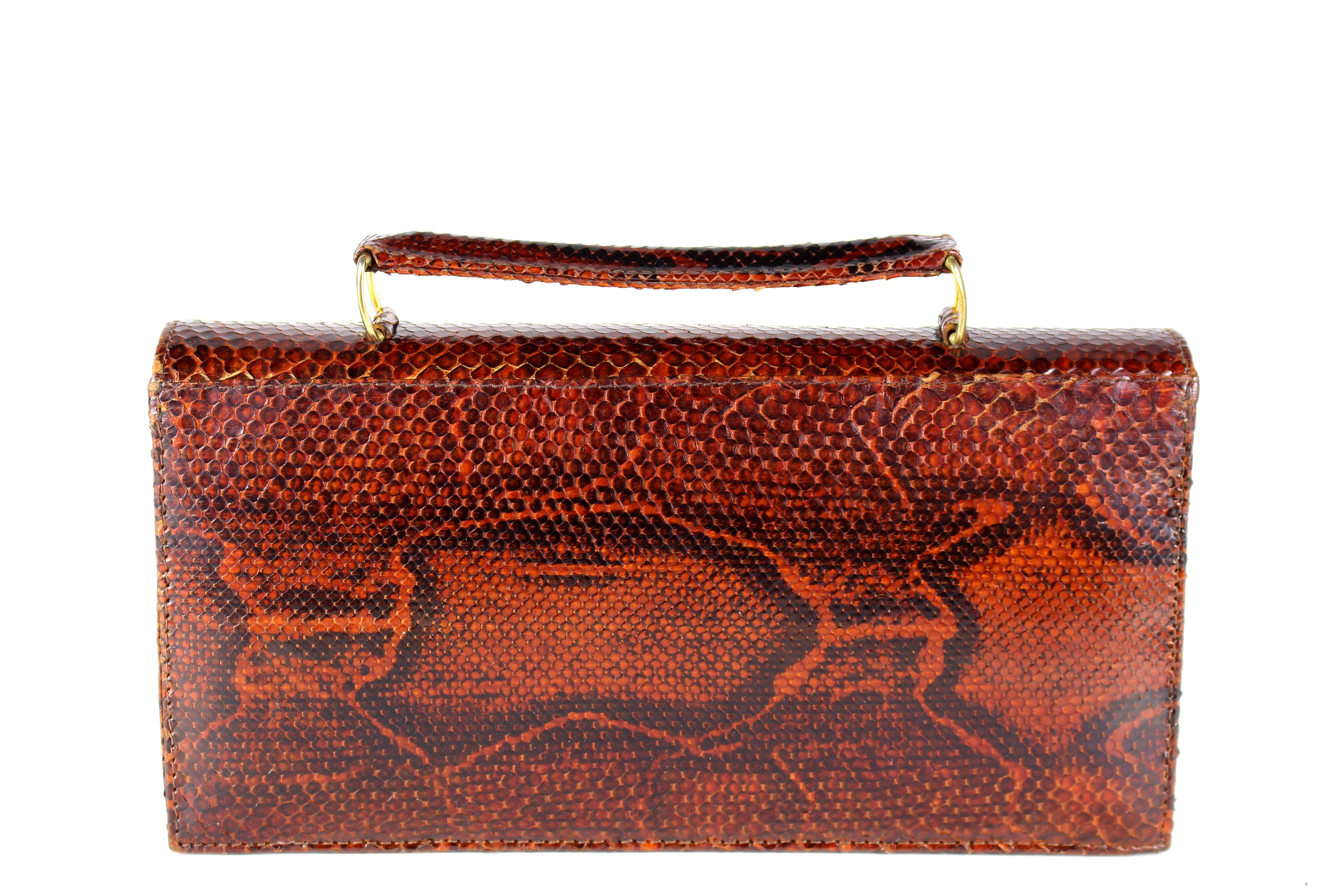 Orange-brown snake skin handbag