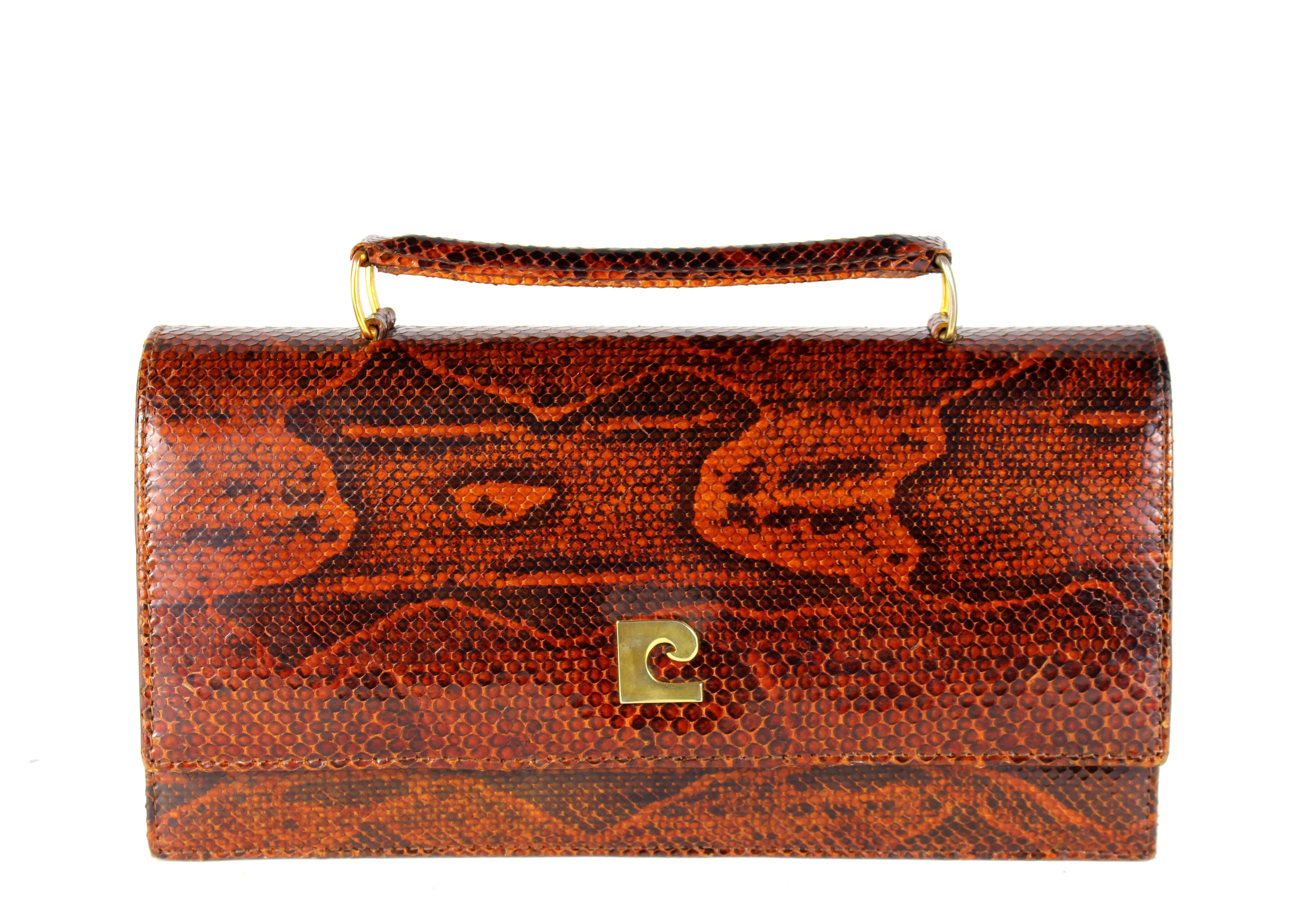 Orange-brown snake skin handbag